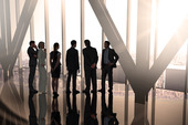 Composite image of business colleagues standing in large room overlooking city创意图片素材 - Wavebreak Media RF