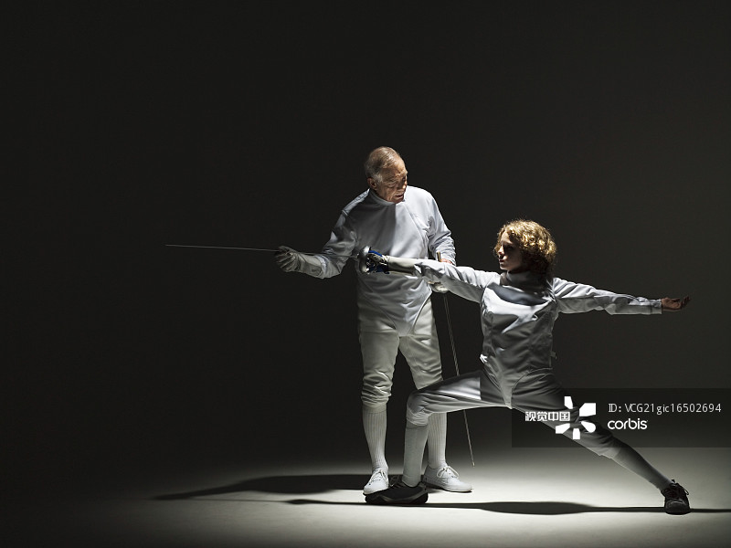 Fencing Student and Instructor