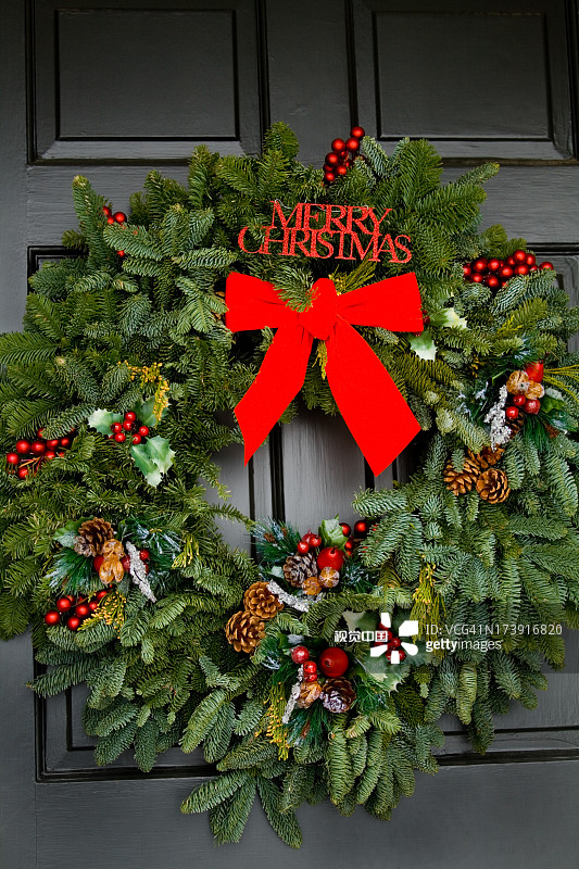 christmas wreath on black door