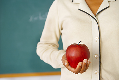 Teacher Holding an Apple corbis图片素材