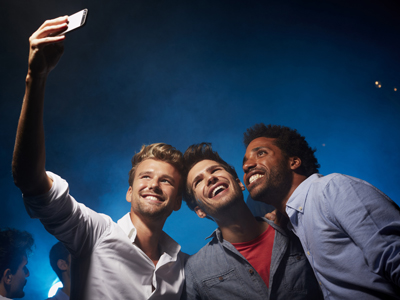 Happy friends taking self portrait at nightclub gettyimages图片素材