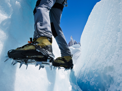 Feet of person hanging on frozen mountainside gettyimages图片素材