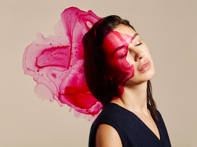 woman with splatters of ink in front of her face gettyimages圖片素材