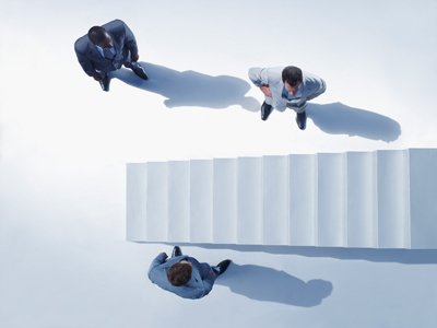 Businessmen at bottom of stairway gettyimages图片素材