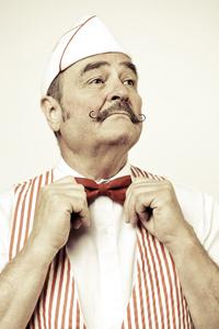 Classic Diner Owner Straightens Bow Tie gettyimages图片素材